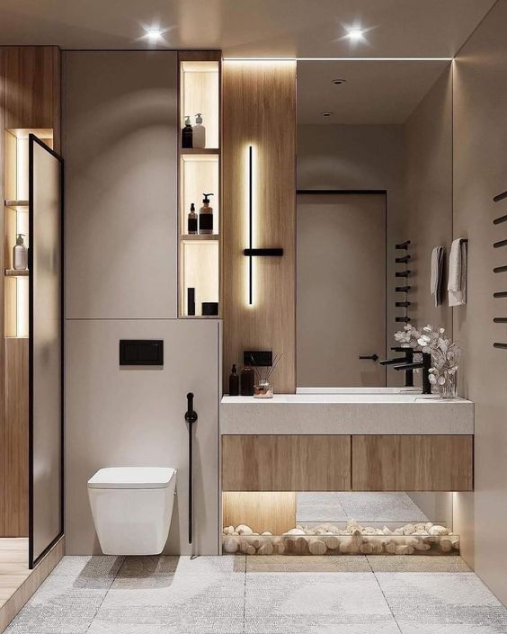 Baño moderno con almacenamiento integrado y detalles de madera.